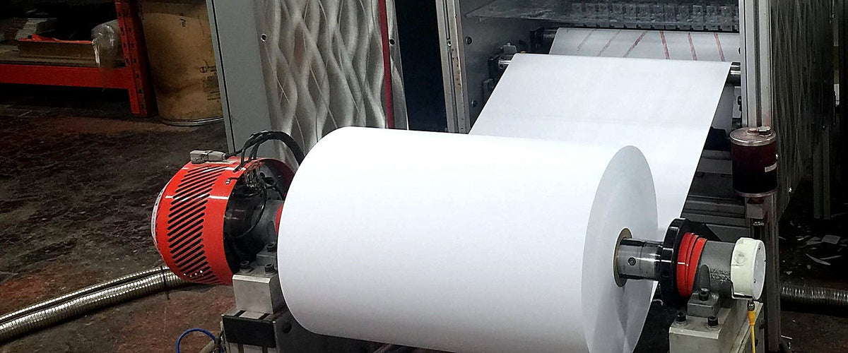 Coreless receipt rolls being wound on our surface winder in Calgary